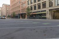 an empty city street is empty and has signs on it that say stop - to - park