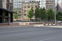 a woman walking down the street in front of buildings and a bench that has many vases on it