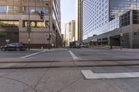 a street intersection that has a lot of traffic on it in the city with cars on it