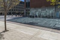 a fire hydrant in front of an office building with glass doors and windows on a sunny day