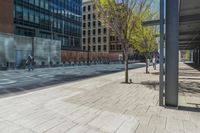 a fire hydrant in front of an office building with glass doors and windows on a sunny day