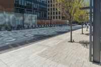 a fire hydrant in front of an office building with glass doors and windows on a sunny day