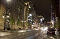 cars traveling down the street at night in downtown chicago, illinois, united states of america