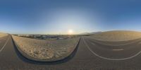 a 360 - view photo taken in the desert at sunrise with a blurry image of the road and the desert