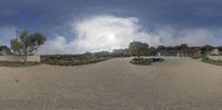 an image of a beachfront house and driveway in the desert of america that appears to be there