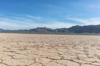 a dry landscape with mountains and sky in the background for advertisement or design purpose, in the middle of this image