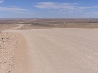 Desert Landscape: Endless Road under Clear Sky