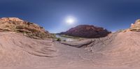 an image of a desert in 360 - view taken with a fisheye lens and an hdr