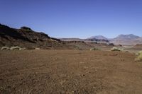 the arid terrain and mountains surround this area for horses to ride in and out of