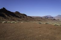 the arid terrain and mountains surround this area for horses to ride in and out of