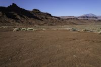 the arid terrain and mountains surround this area for horses to ride in and out of