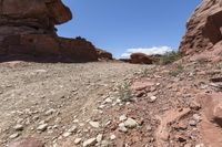 the rocks are big rocks in the desert or an area with no cars on them