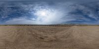 the camera is reflecting the view from a desert landscape area, and is distorted into a mirror