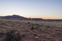 Desert Mountains, Dirt Road, and Low Plain