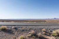 Desert Road: Asphalt and Red Rock