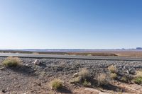 Desert Road: Asphalt and Red Rock