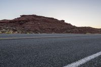 Desert Road at Dawn: A Scenic Mountain Landscape