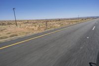 the view from inside a car of an empty highway in motion with cars on both sides of it