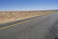 the view from inside a car of an empty highway in motion with cars on both sides of it