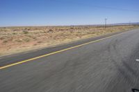 the view from inside a car of an empty highway in motion with cars on both sides of it