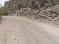 Desert Road in South Africa with Rocky Outcrops