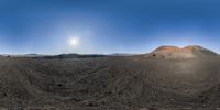 the sun shines brightly in the distance on the desert area of this area as seen through a fish eye lens