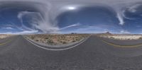 a 360 - view lens shot of the street in the desert with cloud formation above