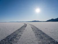 a very long track in the middle of a desert in the middle of the sun