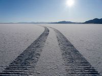 a very long track in the middle of a desert in the middle of the sun