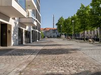 this is a very deserted and empty street in a european city this picture is taken through a window looking back to the sidewalk and street