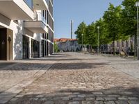 this is a very deserted and empty street in a european city this picture is taken through a window looking back to the sidewalk and street