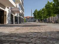 this is a very deserted and empty street in a european city this picture is taken through a window looking back to the sidewalk and street