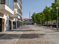 this is a very deserted and empty street in a european city this picture is taken through a window looking back to the sidewalk and street