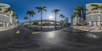 the sun is shining brightly on a deserted street and buildings, seen in a 360 - lens fish eye view