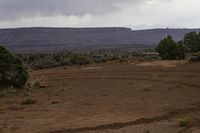 Desolate Landscape Under Grey Sky with Gloomy Clouds