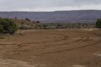 Desolate Landscape Under Grey Sky and Gloomy Clouds