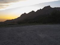 Dirt and Asphalt Road in California: Embracing the Mountain Range