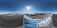 several images of a dirt race track with the sun over them and a blue pool