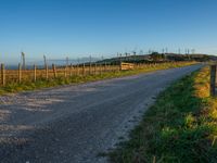 Dirt Road Under Clear Sky at Dawn