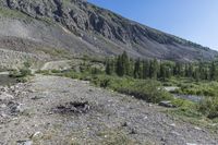 a view of a small mountain lake in the mountains near the ocean of water and rocks