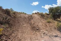 dirt road leading up to the mountains on a sunny day, in arizona's mojaz national preserve