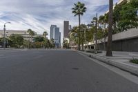 a photo of downtown buildings on a sunny day in las vegas with the cars moving through