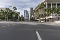 a photo of downtown buildings on a sunny day in las vegas with the cars moving through