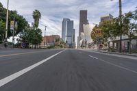 a photo of downtown buildings on a sunny day in las vegas with the cars moving through