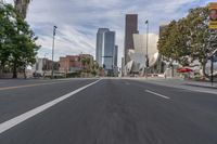 a photo of downtown buildings on a sunny day in las vegas with the cars moving through