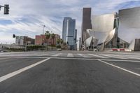 a photo of downtown buildings on a sunny day in las vegas with the cars moving through