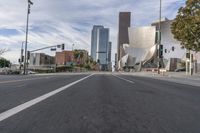 a photo of downtown buildings on a sunny day in las vegas with the cars moving through