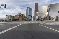 a photo of downtown buildings on a sunny day in las vegas with the cars moving through