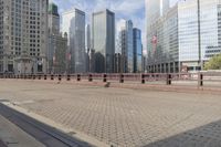 the sidewalk is clean and empty on the city street for people to walk on,