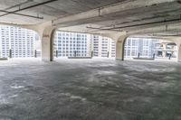 an empty parking garage with large windows and no floor to walk around the room, including a fire hydrant